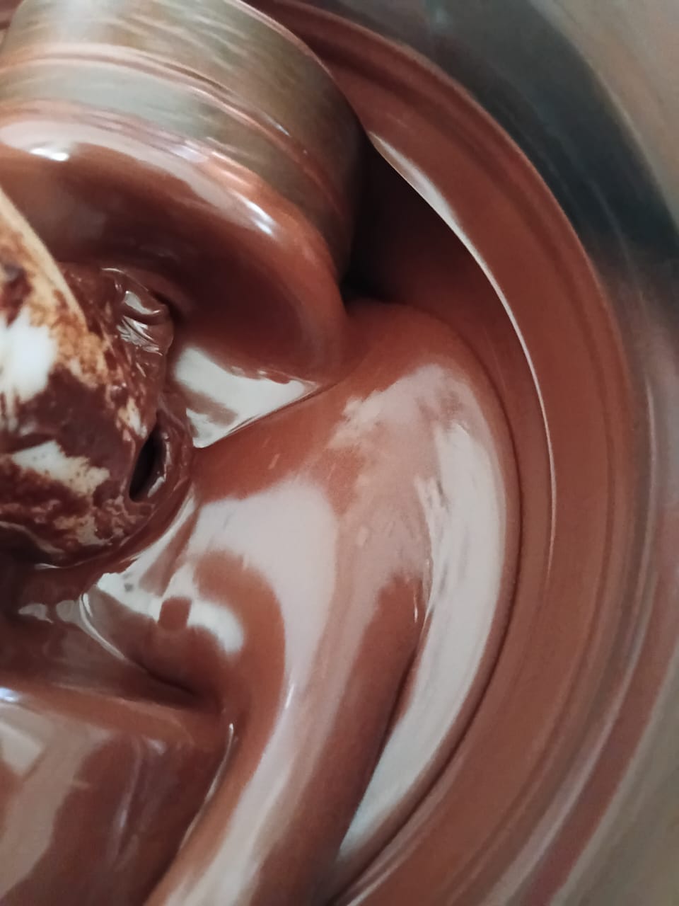 Melted Reve chocolate being hand-crafted in small batches